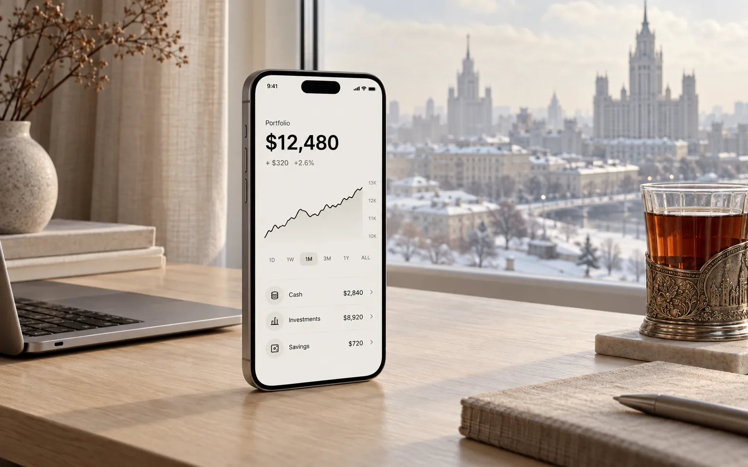 A phone with a fintech app on a birch desk in a Moscow apartment studio in winter light